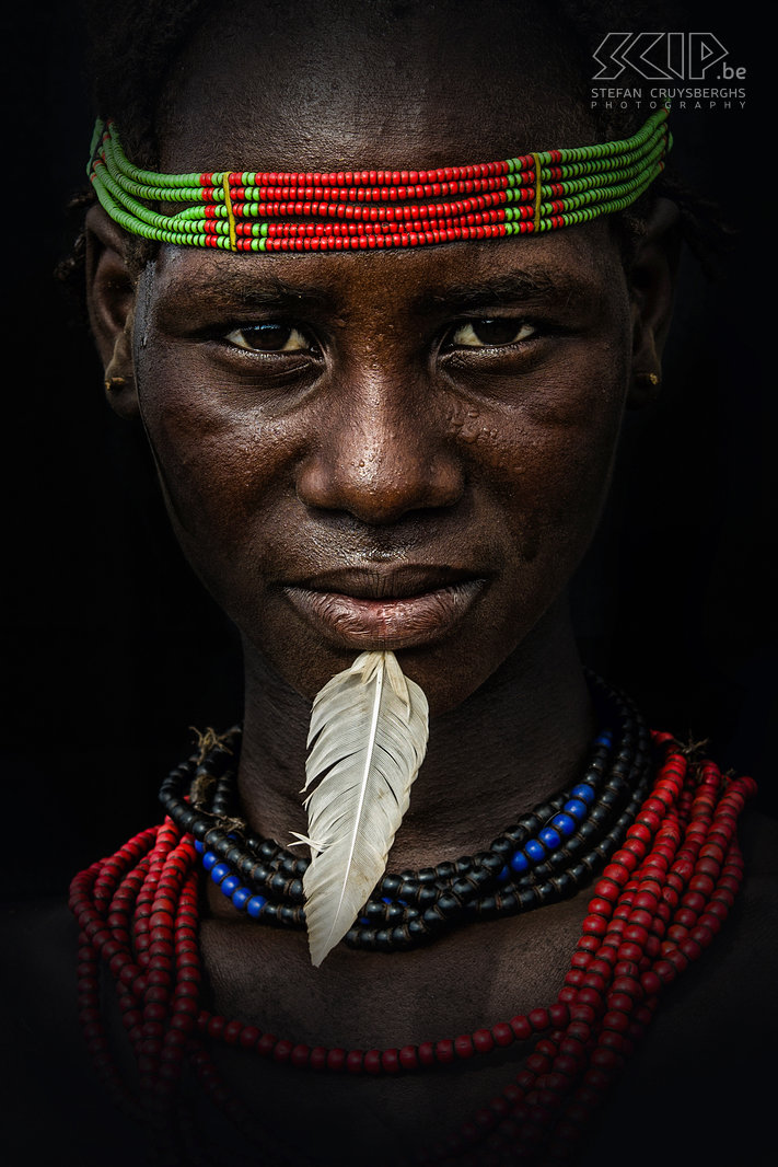 Omorate - Young Dassanech woman The Dassanech women are often elaborately decorated with colourful headbands, beaded necklaces and bracelets. Some of them stab a feather in their chin. Stefan Cruysberghs